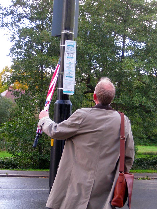 A 6ft tall pedestrian has difficulty reading the sign placed 7ft high