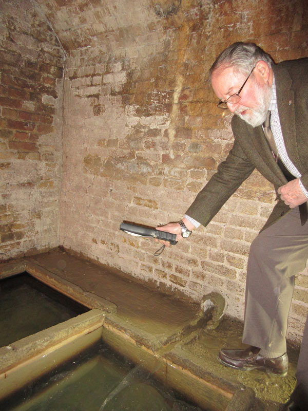 Mike Jordan, chair of Barnet Museum’s trustees, showed visitors the two tanks of spring water inside Barnet’s historic physic well