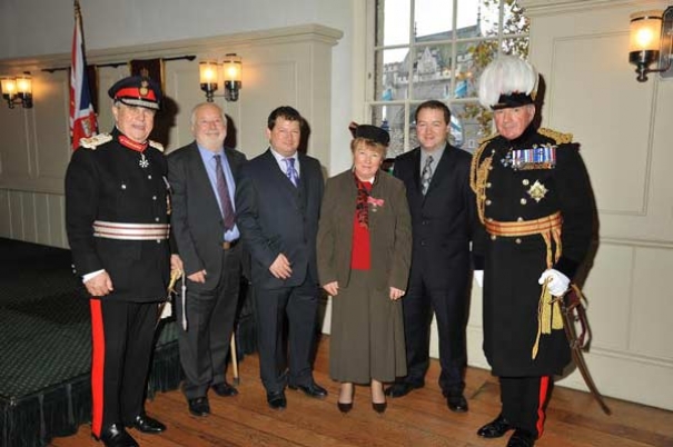 Dr Gillian Gear invested with the Order of the British Empire at the Tower of London in Nov 2014.  L to R: Sir David Brewer, Lord Lieutenant of Greater London; Michael Gear (husband); Tim Gear (son); Gillian Gear; Chris Gear (son); General Lord Dannatt, Constable of the Tower