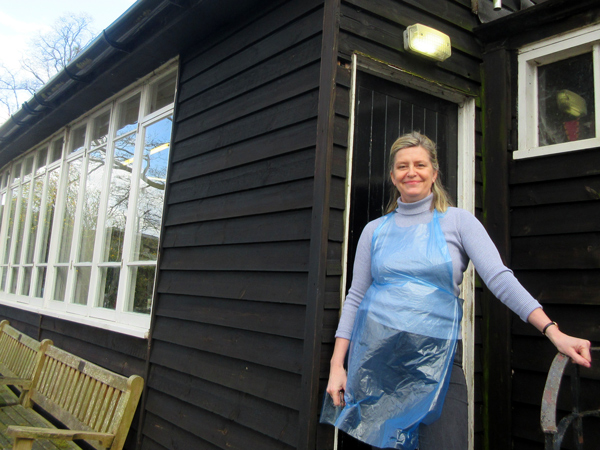 Nichola Hunt-Peasnell, on the steps of their studio in Whalebones Park