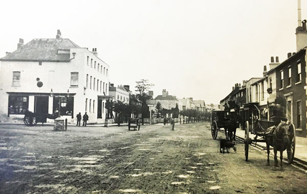 Peter Wanders’ shop is to the right of the pony and trap. This is mid-1880s, before the Corn Exchange, at the corner of High Street and St Albans Road was rebuilt in 1891