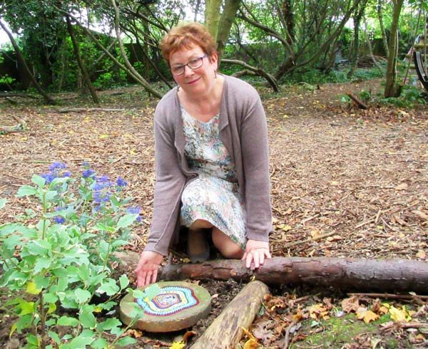 Lesley Graham, project manager beside the memorial to Cira Sale, a former student who died in May at the age of 17