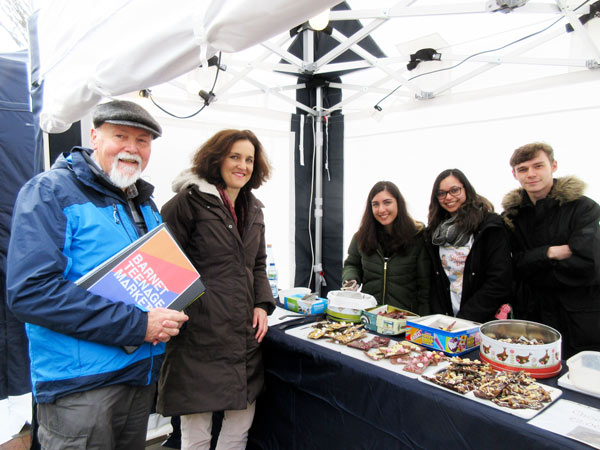 Bob Burstow, organiser of the teenage market, and Theresa Villiers MP, with Rosita Bagherzadeh, Georgia Dias and Nathan Lang selling home-made chocolates and sweets