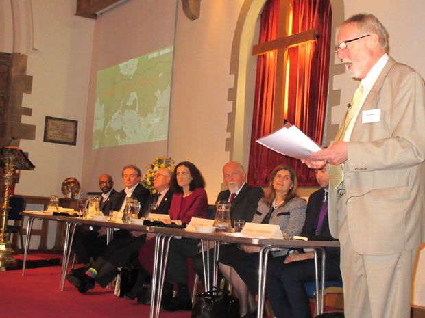 Robin Bishop welcoming the panel to the Barnet Society’s spring forum, Barnet Beyond Brexit.  From left to right, Cali Ibrahim, Councillor Ross Houston, Richard Knox-Johnston, Theresa Villiers, MP, Bob Burstow, Violet Walker and Chris Fairbairn