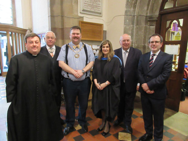 Violet Walker, headteacher, welcoming guests at St John the Baptist. From left to right, the Rector Father Chris Ferris, the Deputy Lieutenant for Barnet, Martin Russell, the Mayor of Barnet, Councillor Reuben Thompstone, Violet Walker, Martyn Bradish, chairman of the endowment fund for the schools of Queen Elizabeth the first, Barnet, and Neil Enright, headteacher of Queen Elizabeth’s Boys’ School